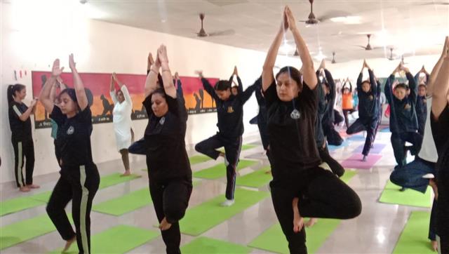 college celebrating International yoga Day